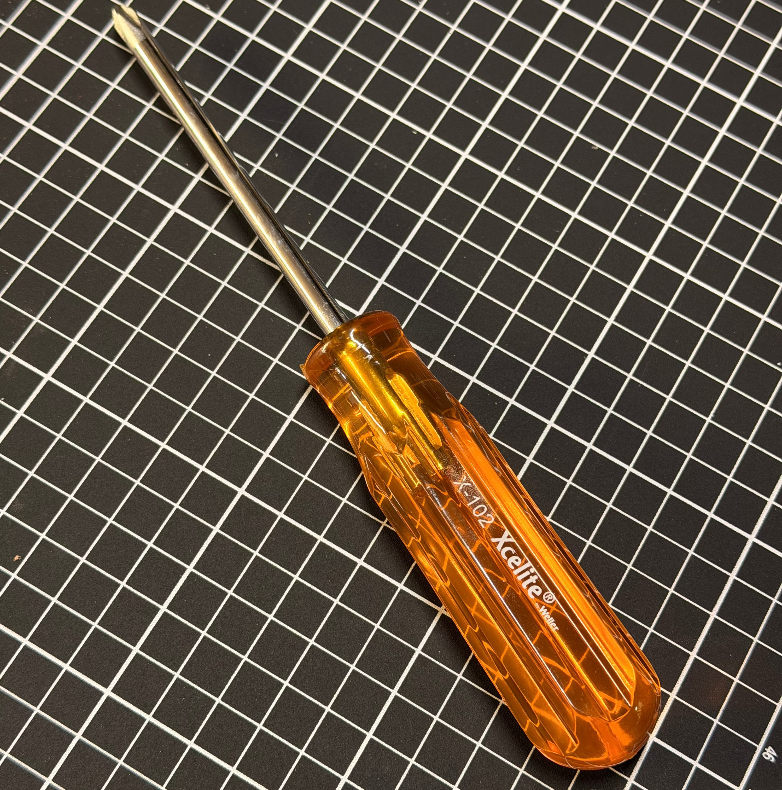 Screwdriver on a cutting mat