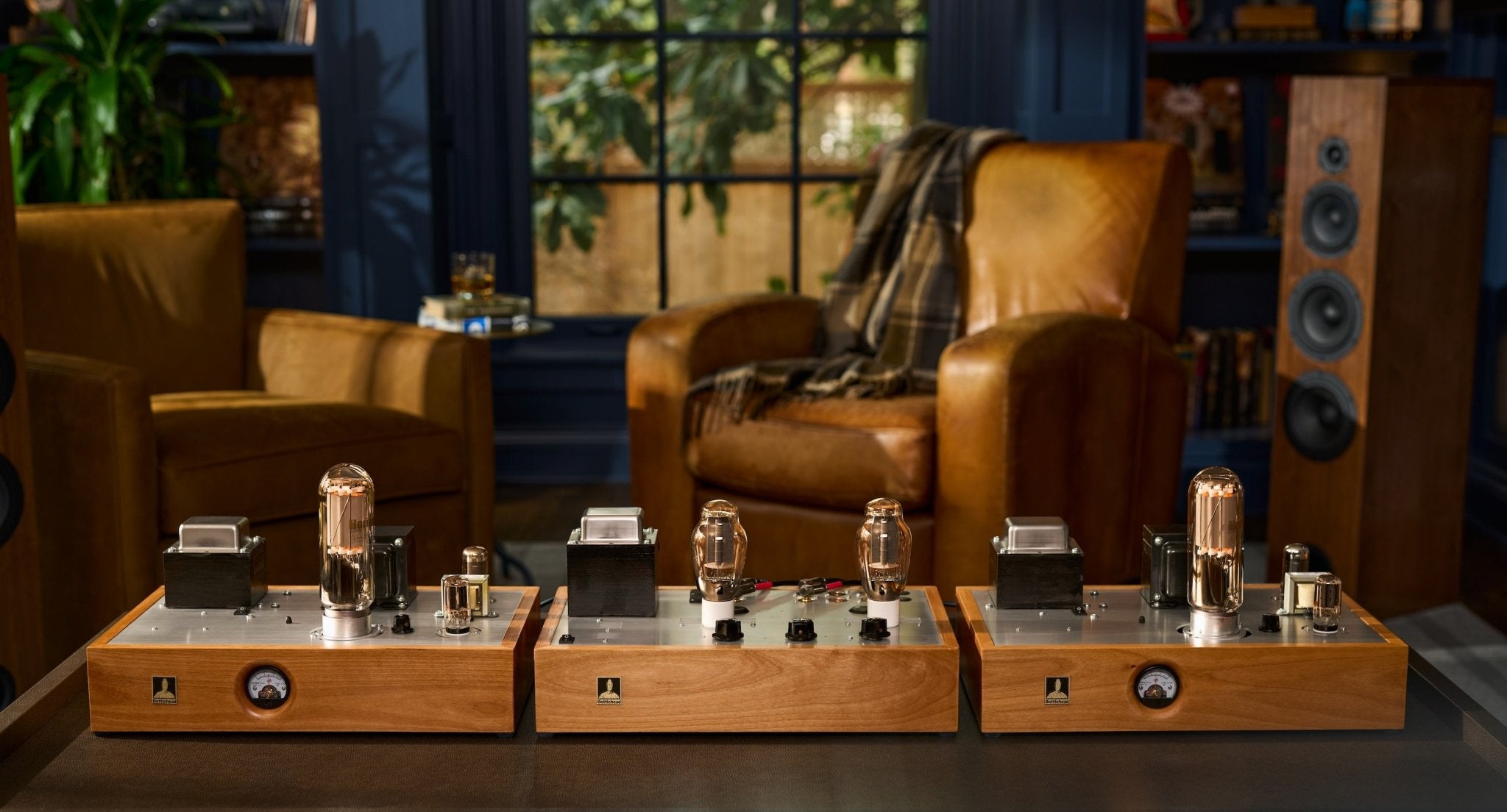 Bottlehead Paradyne monoblocks and a BeePre2 preamplifier in a cozy room with leather chairs and speakers.